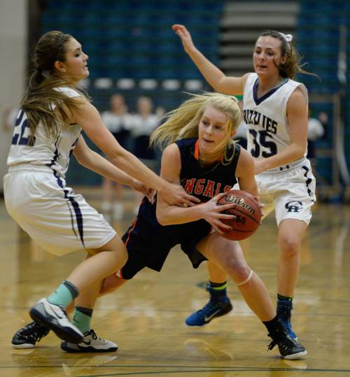 Francisco Kjolseth  |  The Salt Lake Tribune 
Alyssa Hirschi of Copper Hills tries to get past the Brighton defense in the class 5A game the No. 2-ranked teams battling it out at Copper Hills in West Jordan on Thursday night, Jan. 29, 2015.