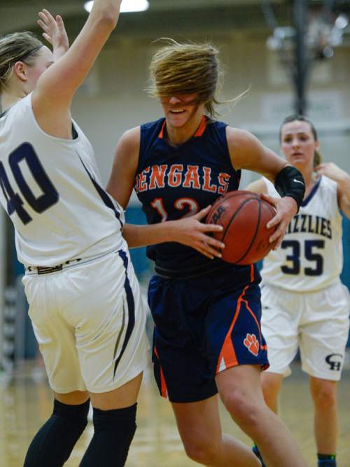 Francisco Kjolseth  |  The Salt Lake Tribune 
Brighton's McCall Christensen is momentarily obscured by her hair as she pushes past Copper Hills in the class 5A game as the No. 2-ranked teams battle it out at Copper Hills in West Jordan on Thursday night, Jan. 29, 2015.