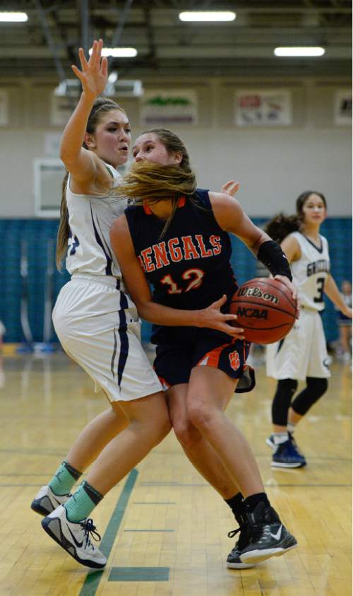 Francisco Kjolseth  |  The Salt Lake Tribune 
Brighton's McCall Christensen trie to get past Mikelle Magalogo of Copper Hills in the class 5A game as the No. 2-ranked teams battle it out at Copper Hills in West Jordan on Thursday night, Jan. 29, 2015.