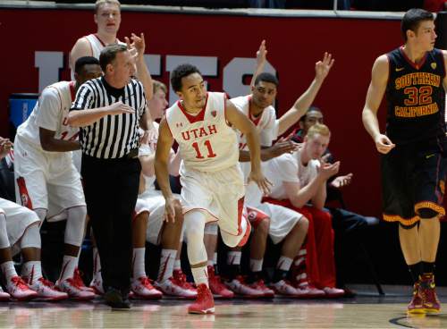 Scott Sommerdorf   |  The Salt Lake Tribune
The Utah bench celebrates another 3-point shot by Utah Utes guard Brandon Taylor (11) during second half play. Utah defeated the USC Trojans 79-55, Friday, January 2, 2015.