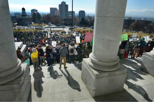 Scott Sommerdorf   |  The Salt Lake Tribune
People filled the lawn in front of the Utah State Capitol building for the Clean Air, No Excuses Rally on Saturday.
