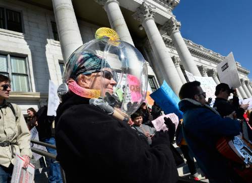 Scott Sommerdorf   |  The Salt Lake Tribune
Bonnie Weiss made a helmet out of two salad bowls to dramatize the bad air she came to protest at the Clean Air, No Excuses Rally held at the south steps of the State Capitol on Saturday.