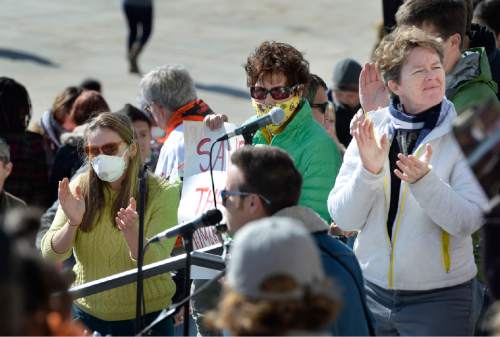 Scott Sommerdorf   |  The Salt Lake Tribune
Some attending clap along with the song "Governor, We Cannot Breathe" at the Clean Air, No Excuses Rally, Saturday, Jan. 31, 2015.