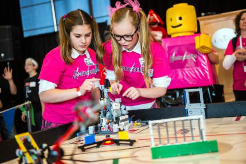 Chris Detrick  |  The Salt Lake Tribune
Electro Cuties team members Hadley Peay, 13, left, and Morgan Topham, 13, of Alpine, compete in the Fifth Annual Utah FIRST LEGO League State Championship at the University of Utah Union Building Saturday January 31, 2015.
