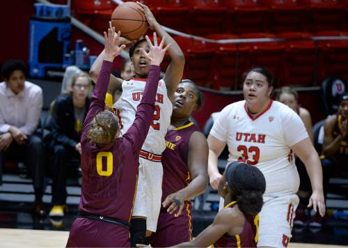 Scott Sommerdorf   |  The Salt Lake Tribune
Somehow Utah Utes forward Tanaeya Boclair (32) got this shot to go while sandwiched between two Arizona State Sun Devils on this first half play. Arizona State beat Utah 58-48, Sunday, February 1, 2015.