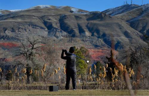 Scott Sommerdorf   |  Tribune file photo
Lalo Enriquez tees off on the 10th hole at Rose Park Golf Course last month. This course is one that could be on Salt Lake City's hit list for balancing the golf-fund budget. The City Council is holding a public hearing Tuesday night.