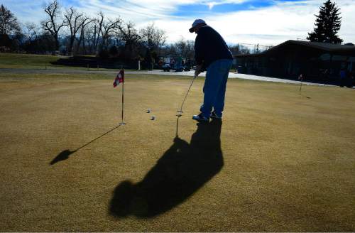 Scott Sommerdorf   |  The Salt Lake Tribune
Chris Schwab practices putting prior to his round at Rose Park Golf Course, Sunday, January 18, 2015. The Salt Lake City Council is nearing a deadline for its eight-course golf system, after having been warned by Mayor Ralph Becker that it needs to be in the black by mid-February.