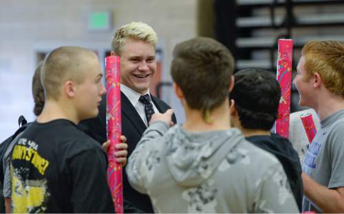 Francisco Kjolseth  |  The Salt Lake Tribune 
Salem Hills quarterback/linebacker Porter Gustin, has fun with friends prior to his announcement that he plans to attend USC during a school assembly on Tuesday, Feb. 3, 2015.