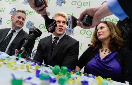 Francisco Kjolseth  |  The Salt Lake Tribune 
Salem Hills quarterback/linebacker Porter Gustin, one of the most highly touted prep football prospects in recent memory, answers questions from the media alongside his  parents John and Scarlett Gustin, following his announcement that he plans to attend USC during a school assembly on Tuesday, Feb. 3, 2015.