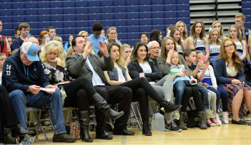 Francisco Kjolseth  |  The Salt Lake Tribune 
Family and friends gather for a school assembly to hear the announcement by Salem Hills quarterback/linebacker Porter Gustin, that he plans to attend USC on Tuesday, Feb. 3, 2015.