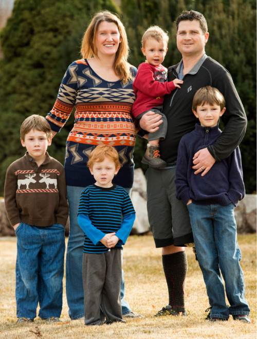Rick Egan  |  The Salt Lake Tribune

 Sara and Jarem Frye with their four sons.   (Front L-R) Jude, Gideon and Ari. Jarem is holding Maxwell, at her parents home in Provo, Wednesday, February 4, 2015. Sara Frye is pregnant with her fifth child.
