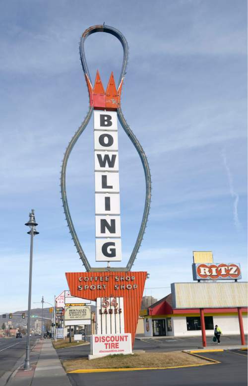 Al Hartmann  |  The Salt Lake Tribune
The iconic sign for AMF Ritz Classic Lanes still stands along 2265 S. State St. Thursday, Feb. 5, 2015, while salvage work goes on inside the 54-lane bowling alley. A sign on the alley's main entrance, "We're sorry to say that AMF Ritz Classic has closed. Thank you for your patronage and support over the years."