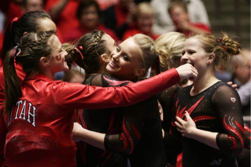 Kim Raff  |  The Salt Lake Tribune
Utah gymnast Georgia Dabritz celebrates with her teammates after  receiving a 10.00 for her routine on the uneven bars a during a meet against Florida at the Huntsman Center in Salt Lake City on March 16, 2013.