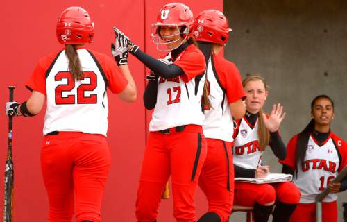 Leah Hogsten  |  The Salt Lake Tribune
Utah's' Anissa Urtez #17 congratulates teammates Shelby Pacheco #12 and Kendal Bergman #22 for their scoring runs in the bottom of the third. University of Utah women's softball team defeated Southern Utah University 12-4 during their first game of a doubleheader, Tuesday, April 22, 2014.