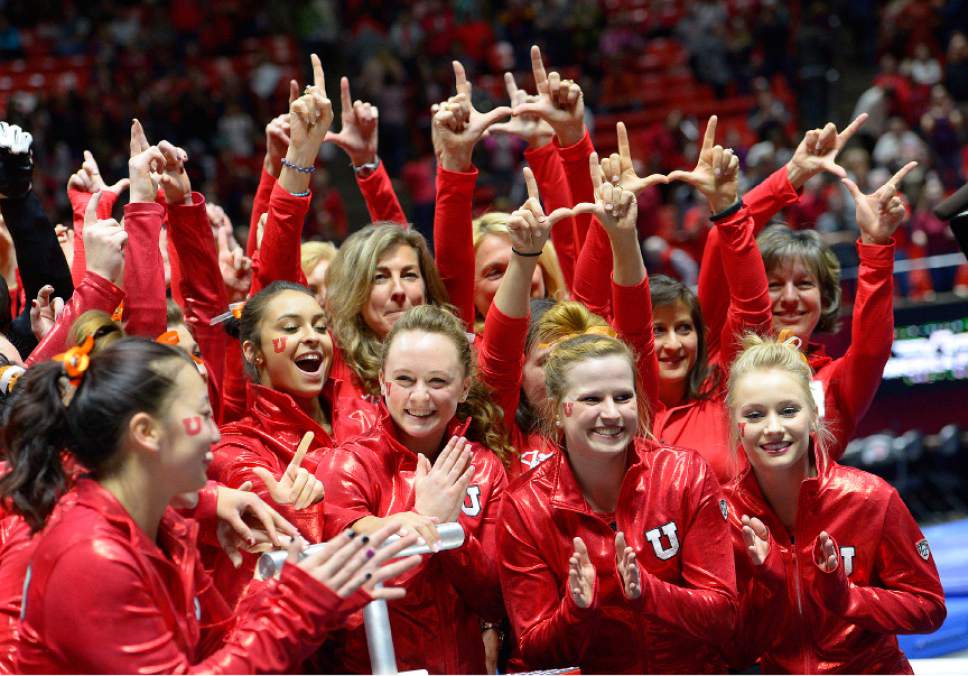 Leah Hogsten  |  The Salt Lake Tribune
University of Utah women's gymnastics team celebrates their win over Arizona State, Friday, February 6, 2015 with alumni members of the Utes Gymnastics team for the past 40 years.
