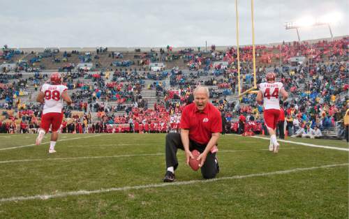 Michael Mangum  |   Tribune file photo
Defensive line coach John Pease runs drills with Utah players during pre-game warmups at Notre Dame Stadium in South Bend, Ind., on Saturday, November 13, 2010.