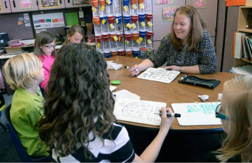 Al Hartmann  |  The Salt Lake Tribune
Fourth-grade teacher Alison Richins works with a small group of students on a math problem using grease boards she received from a grant allowing her to purchase supplies for her classroom. The Jordan Education Foundation will launch a 90-day campaign to raise $1 million for classroom grants in the Jordan School District.
