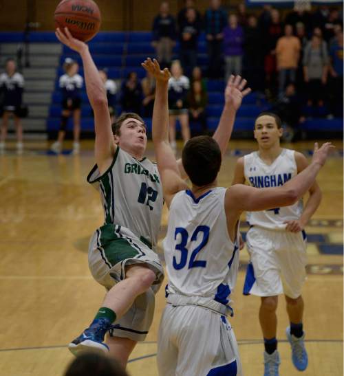 Scott Sommerdorf   |  The Salt Lake Tribune
Copper Hills' Stockton Shorts drives to the hoop during first-half play. Behind Shorts' clutch free throws down the stretch, Copper Hills upset Bingham on the road, Friday, February 6, 2015.
