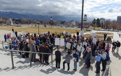 Francisco Kjolseth  |  The Salt Lake Tribune 
People gather on the steps of the Utah Capitol on Tuesday, Feb. 10, 2015, to push for criminal justice reform that would be linked to the current prison relocation plans, by increasing treatment programs and reducing drug possession charges from felonies to misdemeanors.