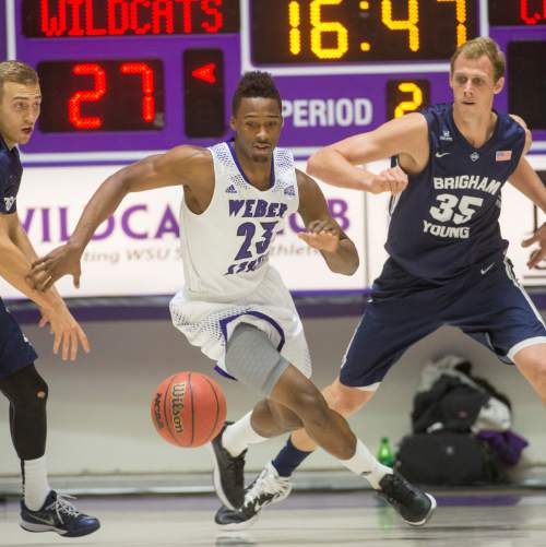 Rick Egan  |  The Salt Lake Tribune

Weber State Wildcats guard Richaud Gittens (23) races after a loose ball, in basketball action BYU vs Weber State, at the Dee Events Center in Ogden, Saturday, December 13, 2014