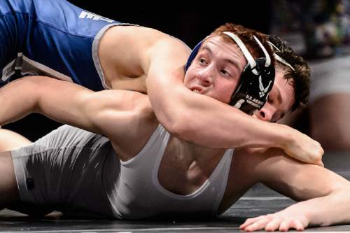 Trent Nelson  |  The Salt Lake Tribune
Benjamin Anderson of Pleasant Grove, top, wrestles Dallin Denton of Fremont in the 132 lb. 5A state championship wrestling match at Utah Valley University in Orem, Thursday February 12, 2015.