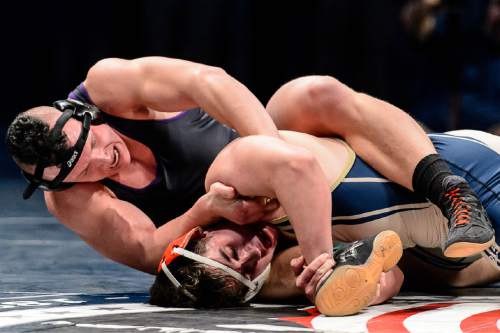 Trent Nelson  |  The Salt Lake Tribune
Wade French of Herriman, front, defeated Simeon Page of Riverton in the 220 lb. 5A state championship wrestling match at Utah Valley University in Orem, Thursday February 12, 2015.