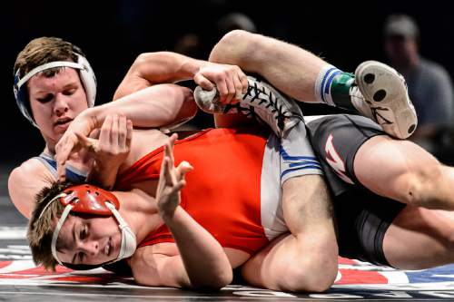 Trent Nelson  |  The Salt Lake Tribune
Josh Anderson of Pleasant Grove, rear, defeated Garrett Hoyt of Weber in the 160 lb. 5A state championship wrestling match at Utah Valley University in Orem, Thursday February 12, 2015.