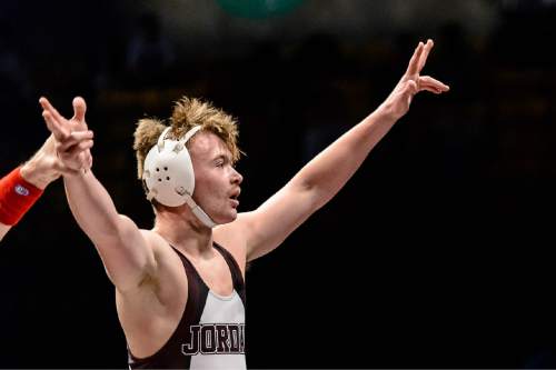 Trent Nelson  |  The Salt Lake Tribune
Tayler Johnson of Jordan celebrates his win in the 152 lb. 5A state championship wrestling match at Utah Valley University in Orem, Thursday February 12, 2015.