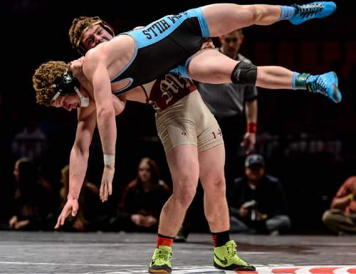 Trent Nelson  |  The Salt Lake Tribune
Johnny O`hearon of Maple Mountain throws Jaxon Vantassell of Salem Hills in the 152 lb. 4A state championship wrestling match at Utah Valley University in Orem, Thursday February 12, 2015.