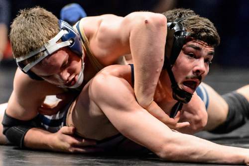 Trent Nelson  |  The Salt Lake Tribune
Jaron Jensen of Herriman, left, defeated Seth Rich of Syracuse in the 138 lb. 5A state championship wrestling match at Utah Valley University in Orem, Thursday February 12, 2015.
