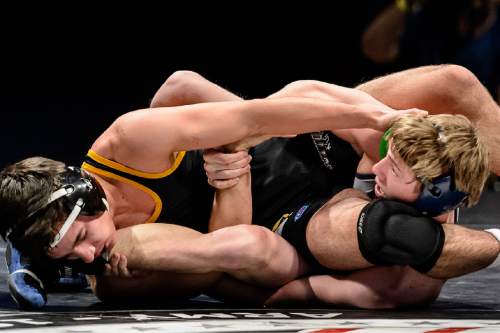 Trent Nelson  |  The Salt Lake Tribune
Jacob Knapp of Cottonwood, left, defeated Colton Berger of Syracuse in the 126 lb. 5A state championship wrestling match at Utah Valley University in Orem, Thursday February 12, 2015.