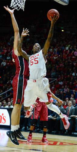 Francisco Kjolseth  |  The Salt Lake Tribune 
Delon Wright of Utah goes to the hoop in game action as they take on the Standford Cardinal on Thursday, Feb. 12, 2015, at the Huntsman Center at the University of Utah.