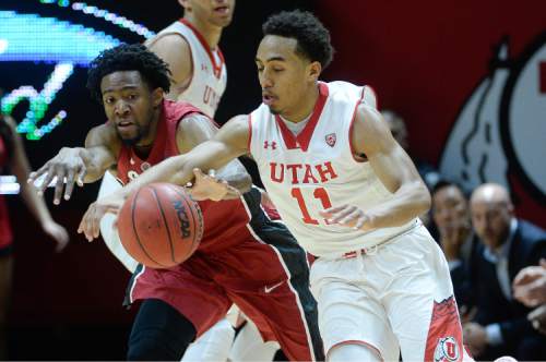 Francisco Kjolseth  |  The Salt Lake Tribune 
Stansford's Chasson Randle tries to steal a ball from Brandon Taylor of Utah in game action on Thursday, Feb. 12, 2015, at the Huntsman Center at the University of Utah.