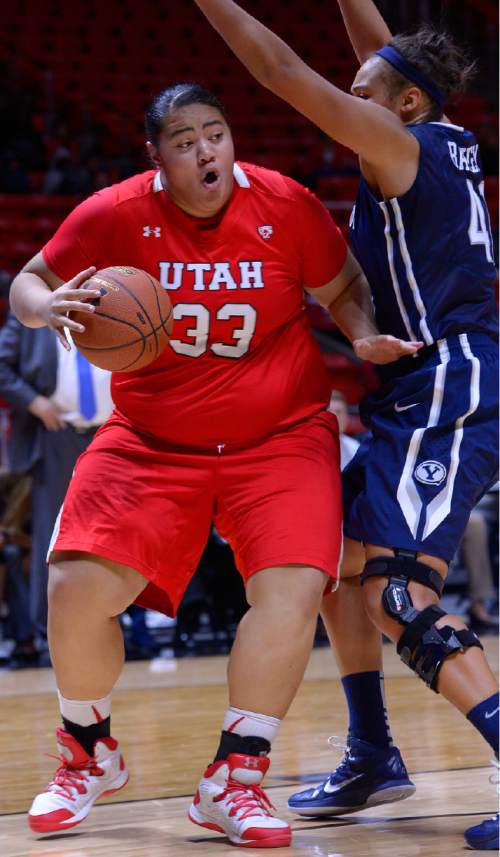 Leah Hogsten  |  The Salt Lake Tribune
Utah Utes center Joeseta Fatuesi (33) drives to the net for two. The University of Utah trail Brigham Young University 32-29, Saturday, December 13, 2014 at the Jon M. Huntsman Center.