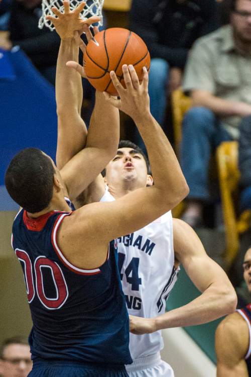 Chris Detrick  |  The Salt Lake Tribune
Brigham Young Cougars center Corbin Kaufusi (44) guards St. Mary's Gaels forward Brad Waldow (0) during the game at the Marriott Center Thursday February 12, 2015.