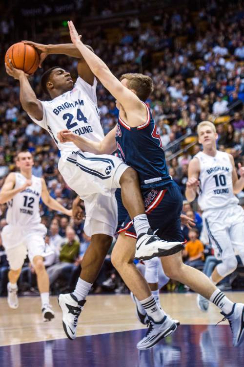 Chris Detrick  |  The Salt Lake Tribune
Brigham Young Cougars guard Frank Bartley IV (24) shoots past St. Mary's Gaels guard Emmett Naar (41) during the game at the Marriott Center Thursday February 12, 2015.