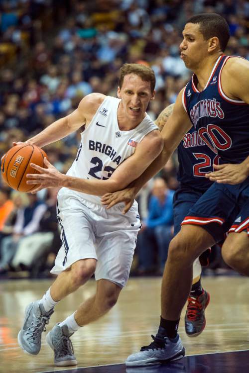 Chris Detrick  |  The Salt Lake Tribune
Brigham Young Cougars guard Skyler Halford (23) runs past St. Mary's Gaels forward Brad Waldow (0) during the game at the Marriott Center Thursday February 12, 2015.