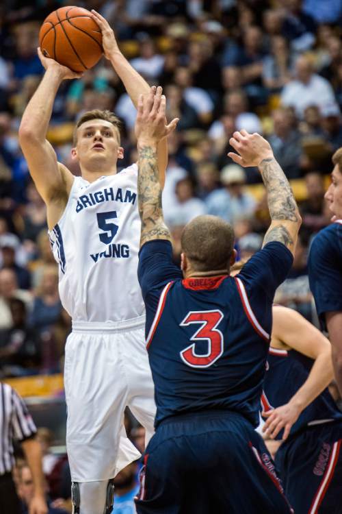 Chris Detrick  |  The Salt Lake Tribune
Brigham Young Cougars guard Kyle Collinsworth (5) shoots past St. Mary's Gaels guard Kerry Carter (3) during the game at the Marriott Center Thursday February 12, 2015.