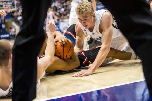 Chris Detrick  |  The Salt Lake Tribune
St. Mary's Gaels forward Garrett Jackson (22) and Brigham Young Cougars forward Ryan Andrus (10) go for the ball during the game at the Marriott Center Thursday February 12, 2015.