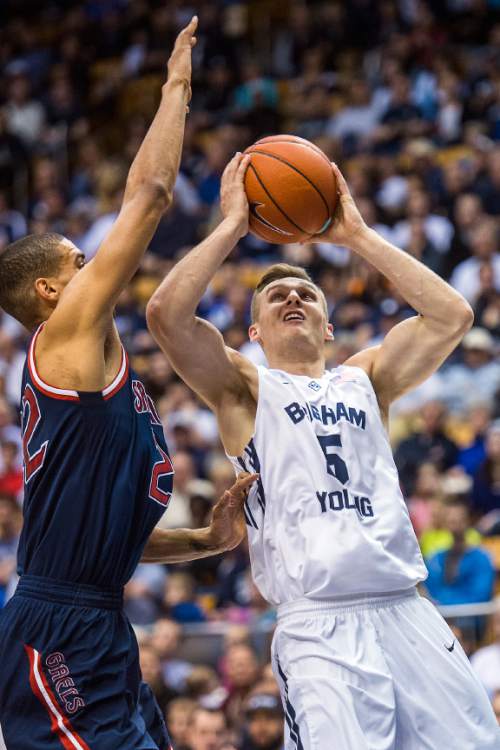 Chris Detrick  |  The Salt Lake Tribune
Brigham Young Cougars guard Kyle Collinsworth (5) shoots past St. Mary's Gaels forward Garrett Jackson (22) during the game at the Marriott Center Thursday February 12, 2015.