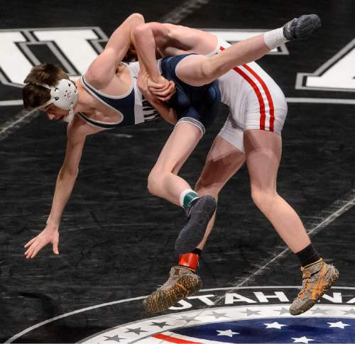 Trent Nelson  |  The Salt Lake Tribune
Trevor Poulsen, Delta, right, faces Caleb Rasmussen, Millard, in the 2A, 113lb championship match at the state wrestling championships in Orem, Saturday February 14, 2015.