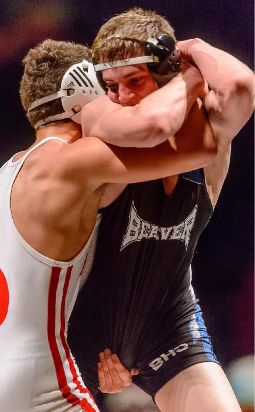 Trent Nelson  |  The Salt Lake Tribune
Trace Willoughby, Delta, left, faces Tyce Raddon, Beaver, in the 2A, 145lb championship match at the state wrestling championships in Orem, Saturday February 14, 2015.