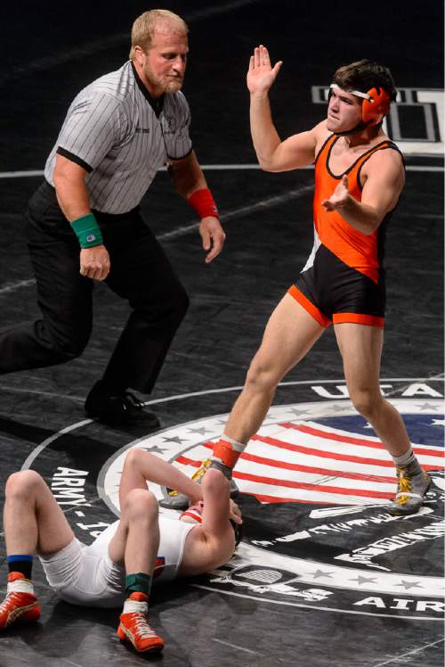 Trent Nelson  |  The Salt Lake Tribune
Zac Musselman, Monticello, celebrates his win over Brady Farnsworth, Altamont, faces in the 1A, 126lb championship match at the state wrestling championships in Orem, Saturday February 14, 2015.
