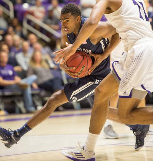 Rick Egan  |  The Salt Lake Tribune

Brigham Young Cougars guard Anson Winder (20) takes the ball to the hoop, as Weber State Wildcats forward Joel Bolomboy (21) defends in basketball action BYU vs Weber State, at the Dee Events Center in Ogden, Saturday, December 13, 2014