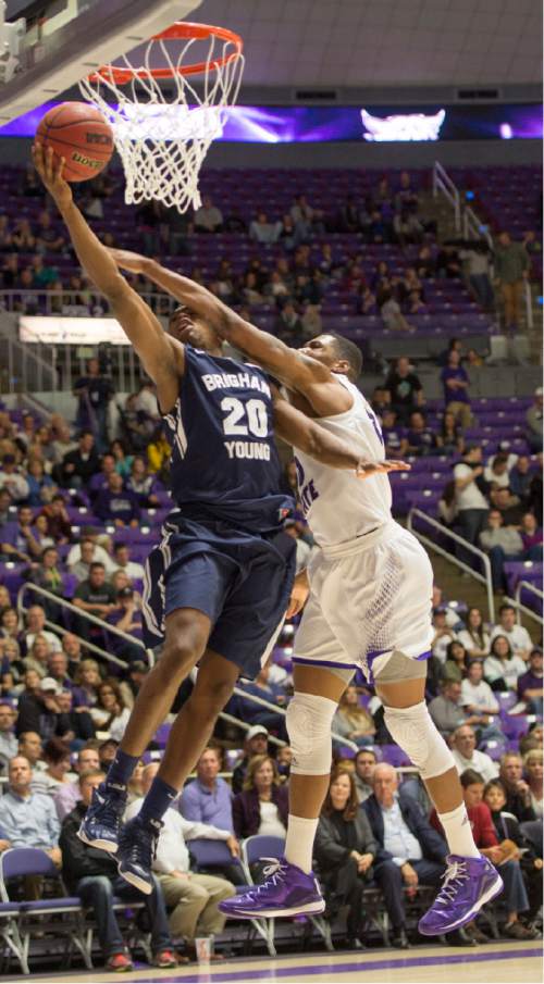 Rick Egan  |  The Salt Lake Tribune

Brigham Young Cougars guard Anson Winder (20) takes the ball to the hoop, Weber State Wildcats guard Jeremy Senglin (30) defends, in basketball action BYU vs Weber State, at the Dee Events Center in Ogden, Saturday, December 13, 2014