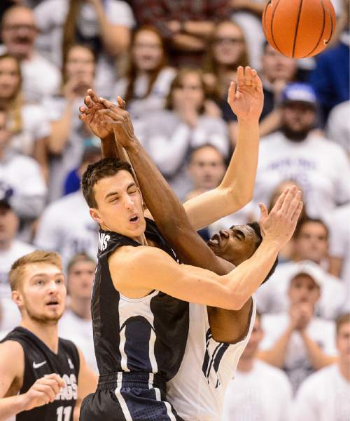 Trent Nelson  |  The Salt Lake Tribune
Gonzaga Bulldogs guard Kyle Dranginis (3) and Brigham Young Cougars guard Anson Winder (20) collide as BYU hosts Gonzaga, men's college basketball at the Marriott Center in Provo, Saturday December 27, 2014.