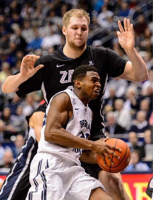 Trent Nelson  |  The Salt Lake Tribune
Brigham Young Cougars guard Anson Winder (20), defended by Gonzaga Bulldogs center Przemek Karnowski (24) as BYU hosts Gonzaga, men's college basketball at the Marriott Center in Provo, Saturday December 27, 2014.