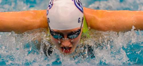 Trent Nelson  |  The Salt Lake Tribune
Woods Cross's Gabrielle Beard in heat 3 of the Women 100 Yard Butterfly at the 4A state swimming championships in Provo, Saturday February 14, 2015.