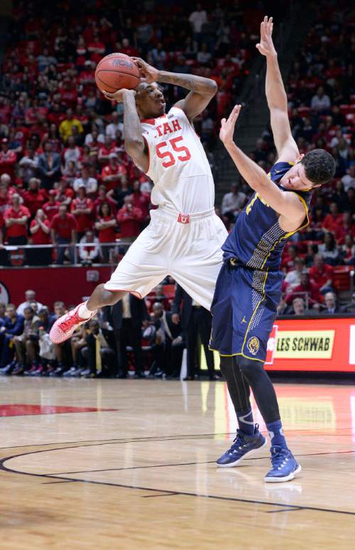 Al Hartmann  |  The Salt Lake Tribune
Ute Delon Wright shoots and Golden Bear Sam Singer gets out of his way in game action at the Huntsman Center Sunday Feb. 15.
