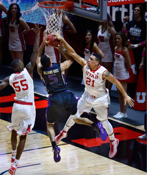 Scott Sommerdorf   |  The Salt Lake Tribune
Utah Utes F Jordan Loveridge (21) blocks this shot by Washington Huskies G Nigel Williams-Goss (5) during first half play. Utah held a 37-30 lead over Washington at halftime at the Hunstman Center, Sunday, January 25, 2015.